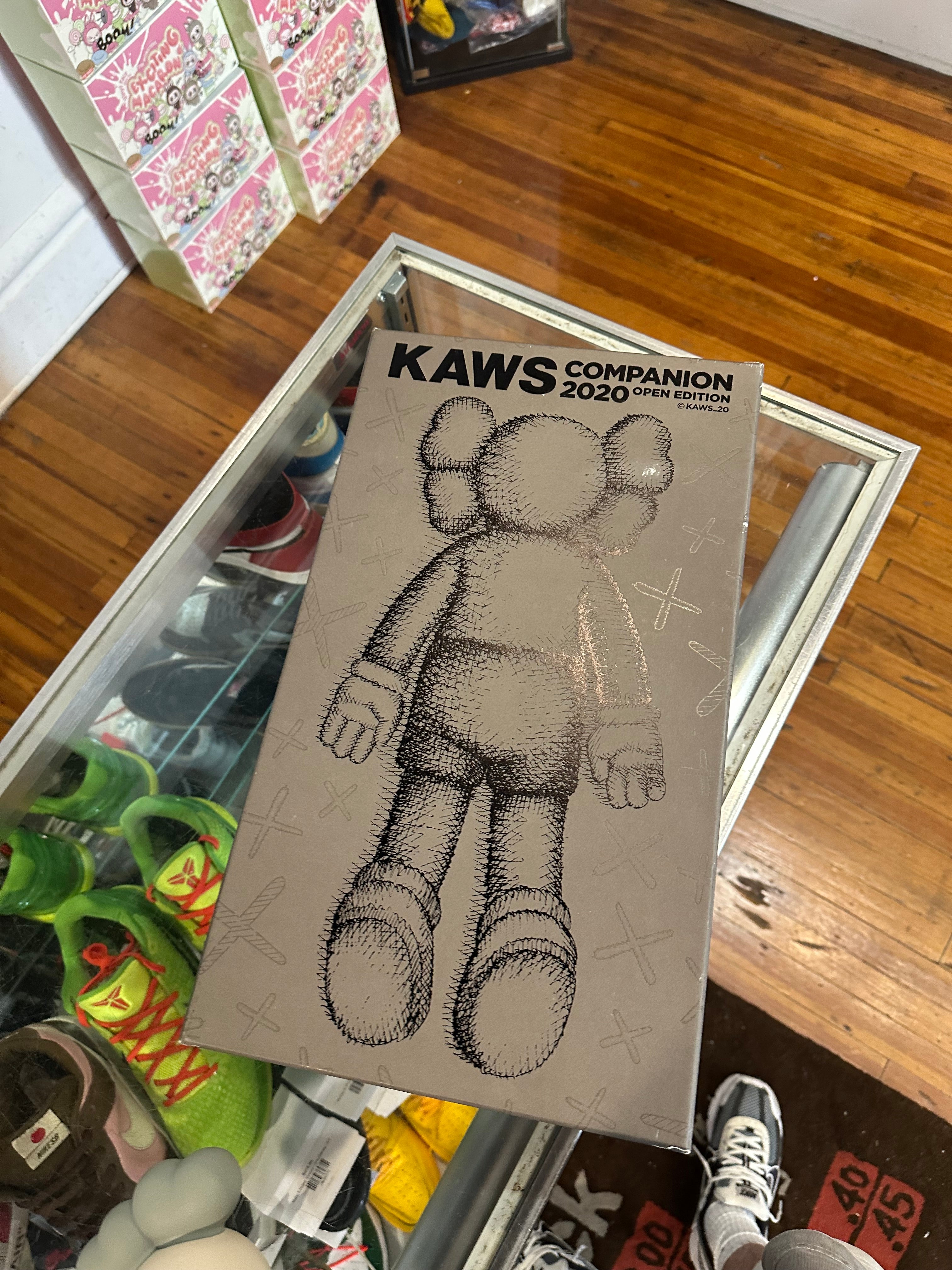KAWS 2020 Vinyl Figure “Laying Down Brown”