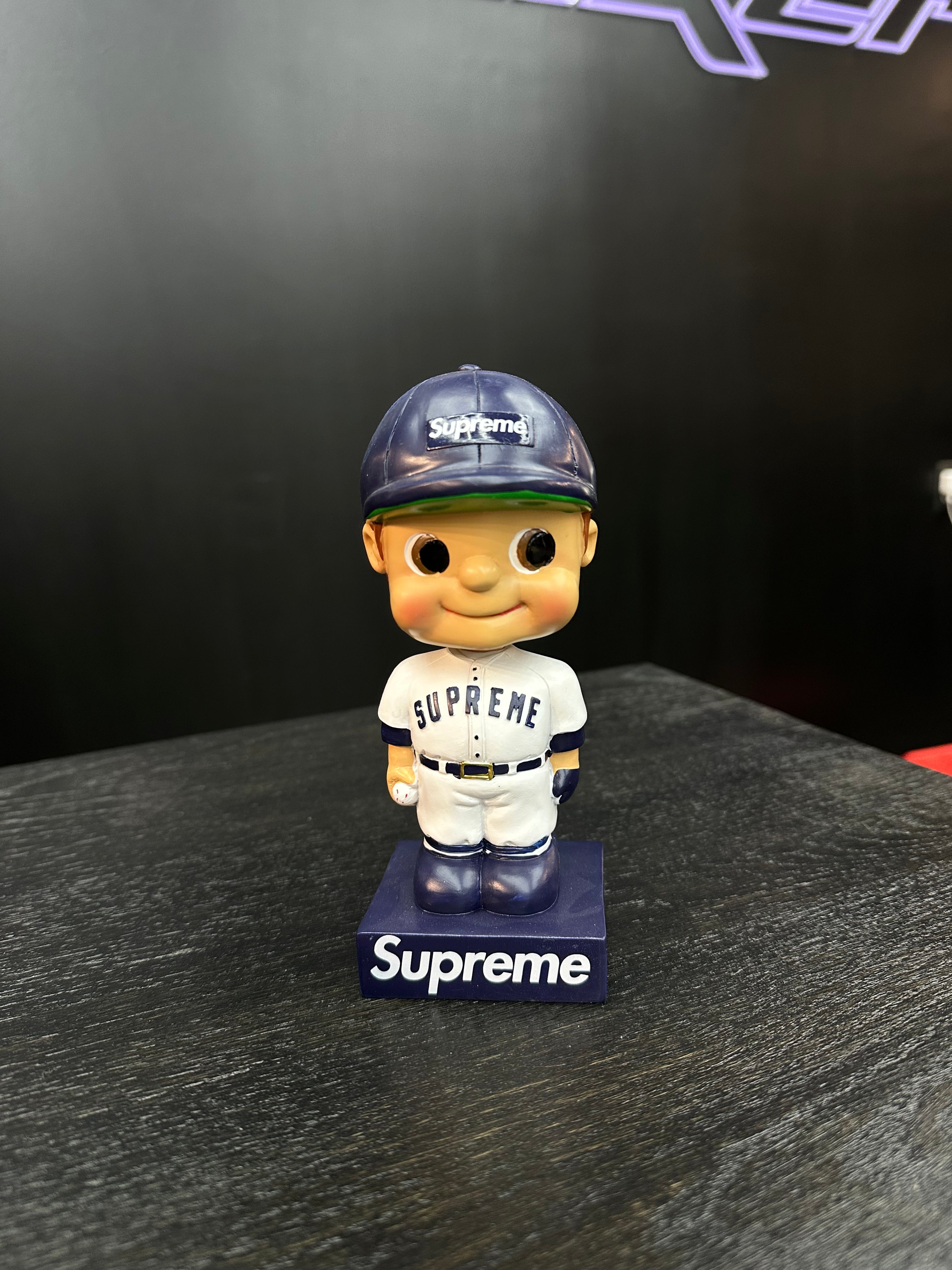 Supreme Bobblehead Figure