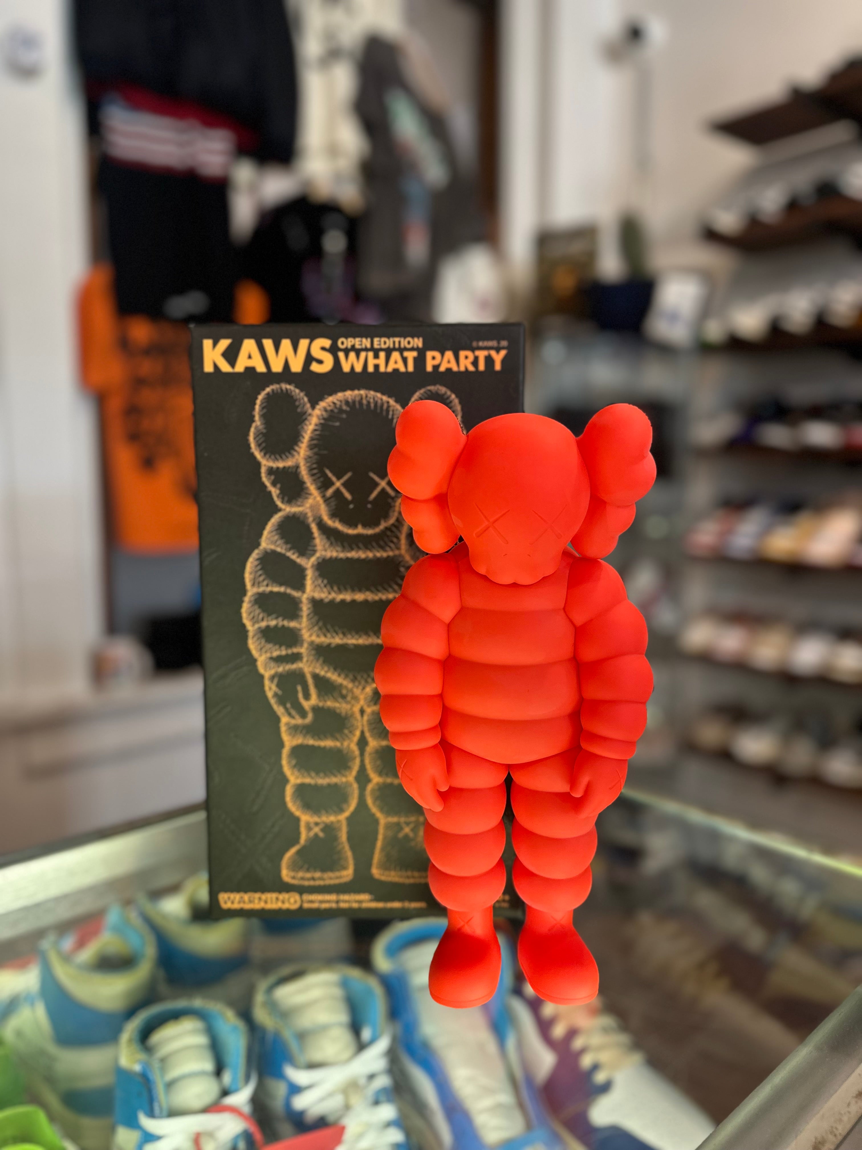 KAWS What Party Vinyl Figure “Orange”