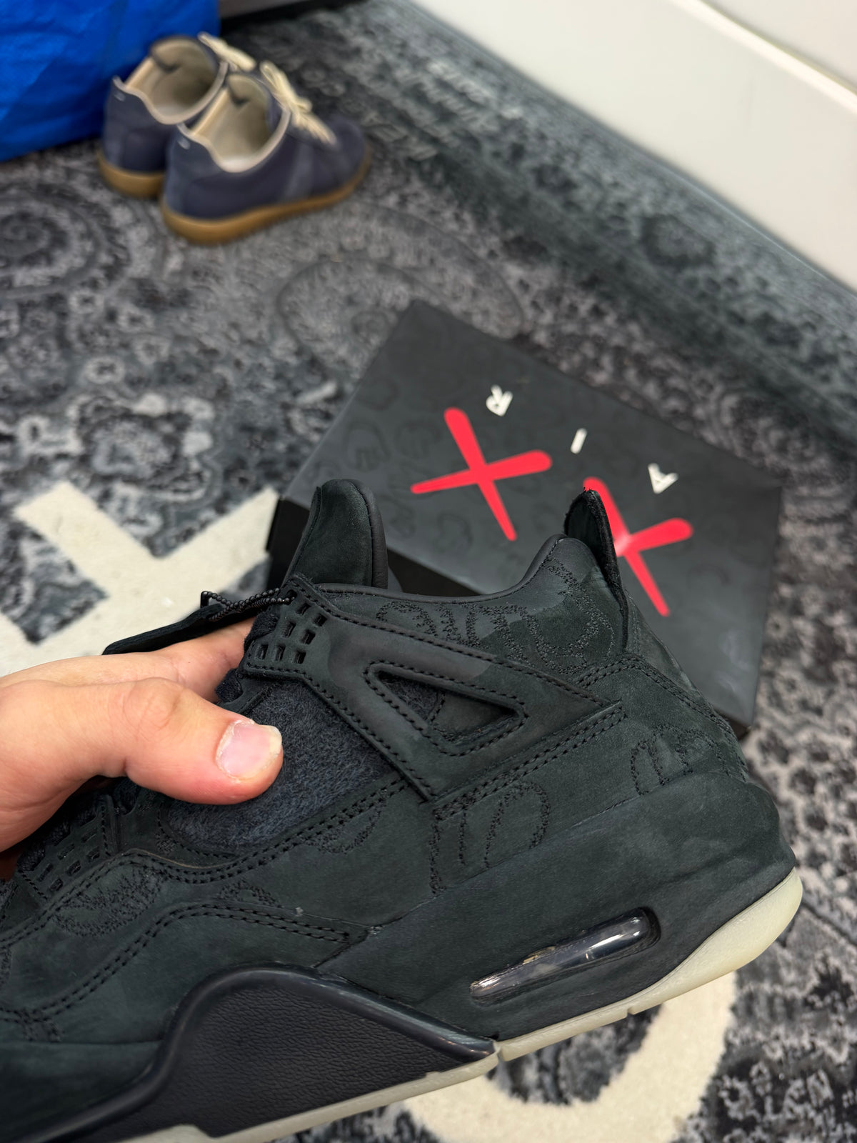 Jordan 4 x Kaws “Black”