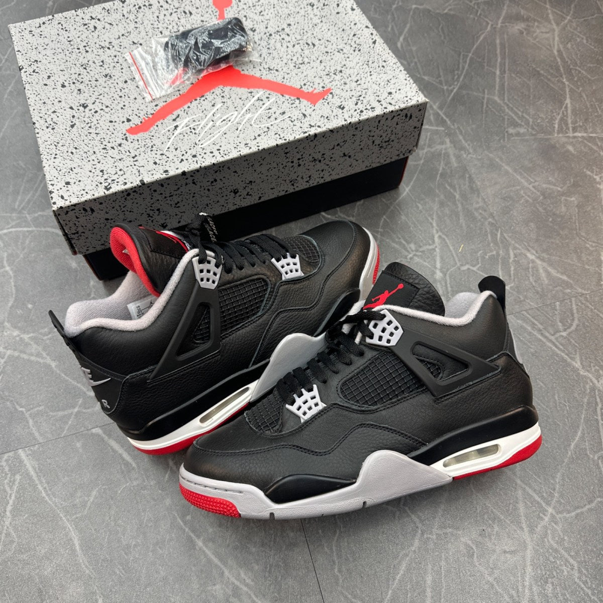 Jordan 4 Retro Bred Reimagined - Image 1
