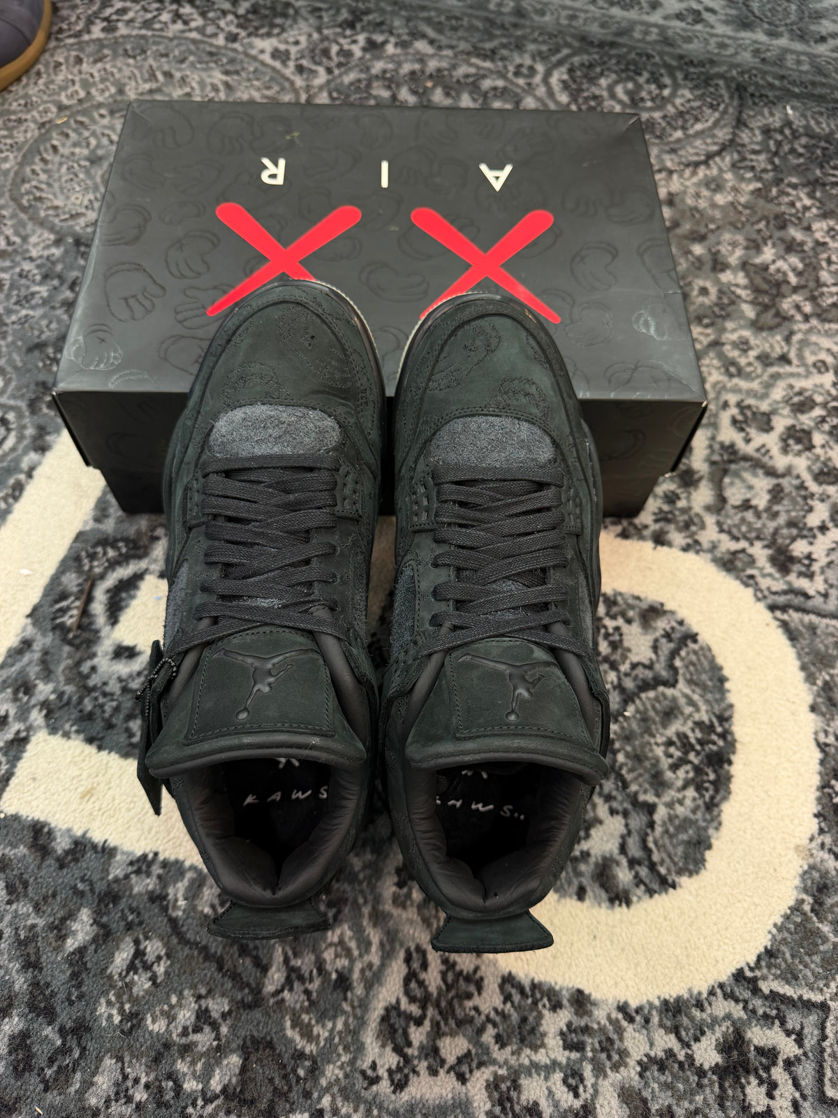 Jordan 4 x Kaws “Black”