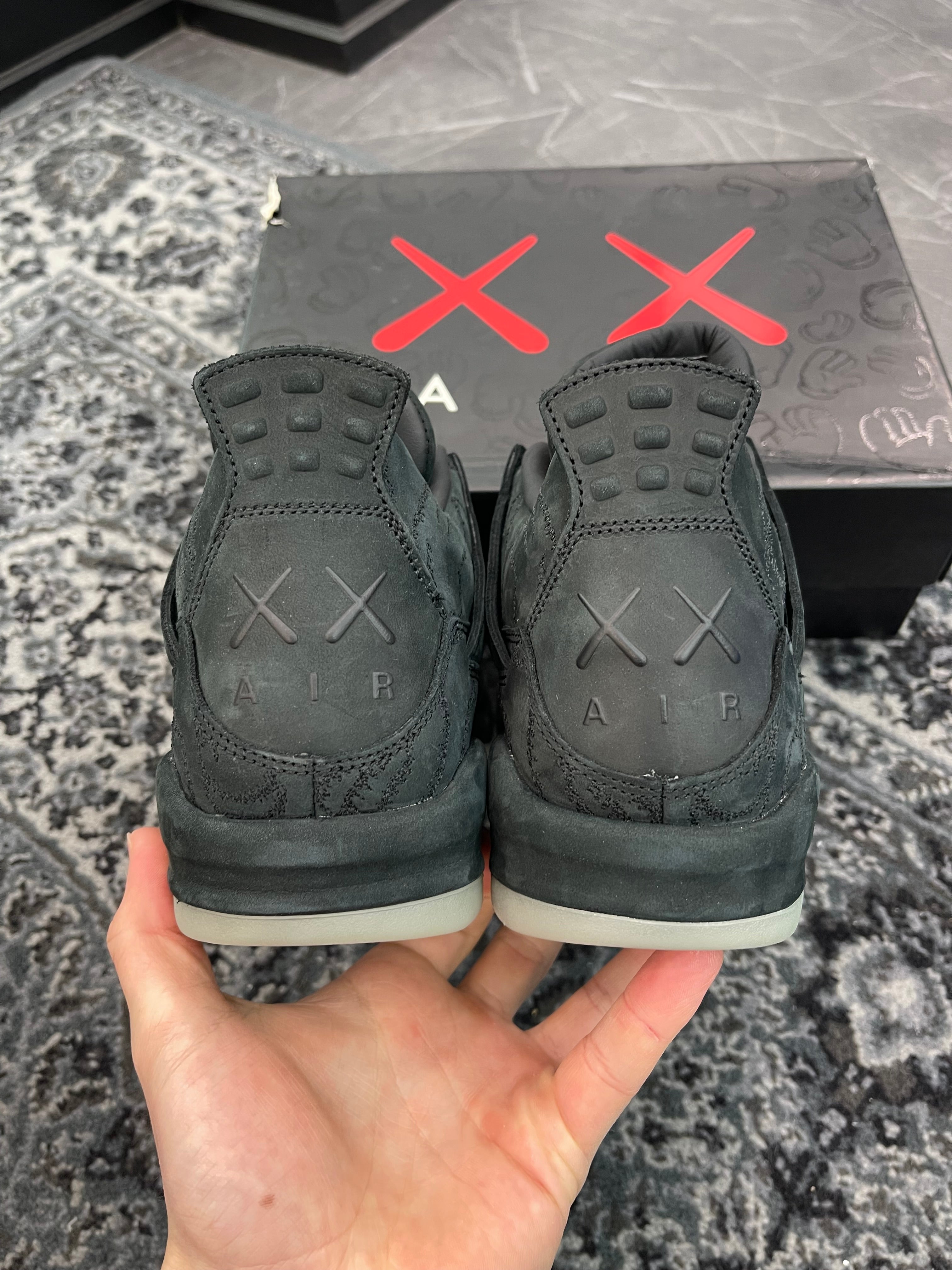 Jordan 4 x Kaws “Black”
