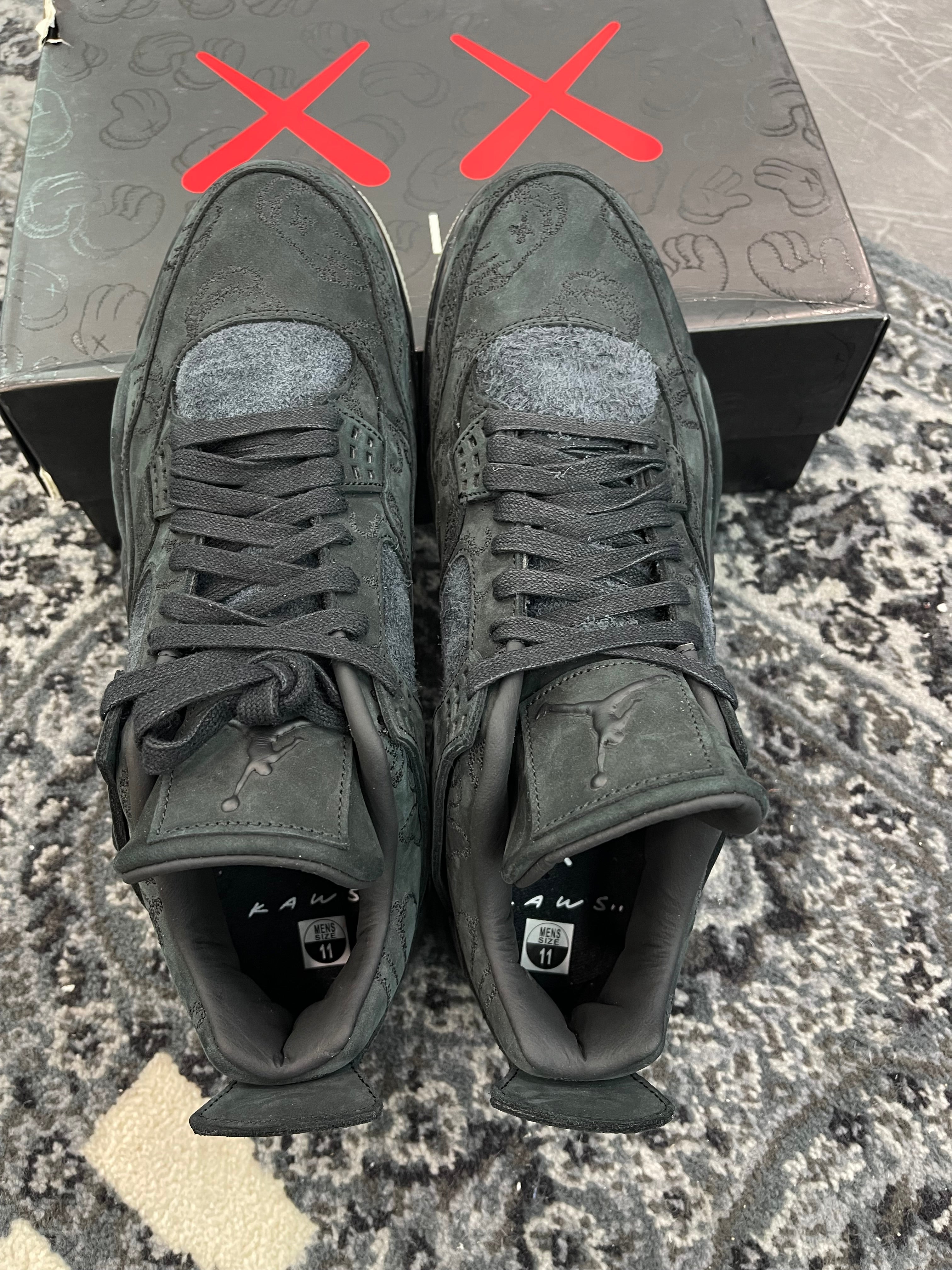 Jordan 4 x Kaws “Black”