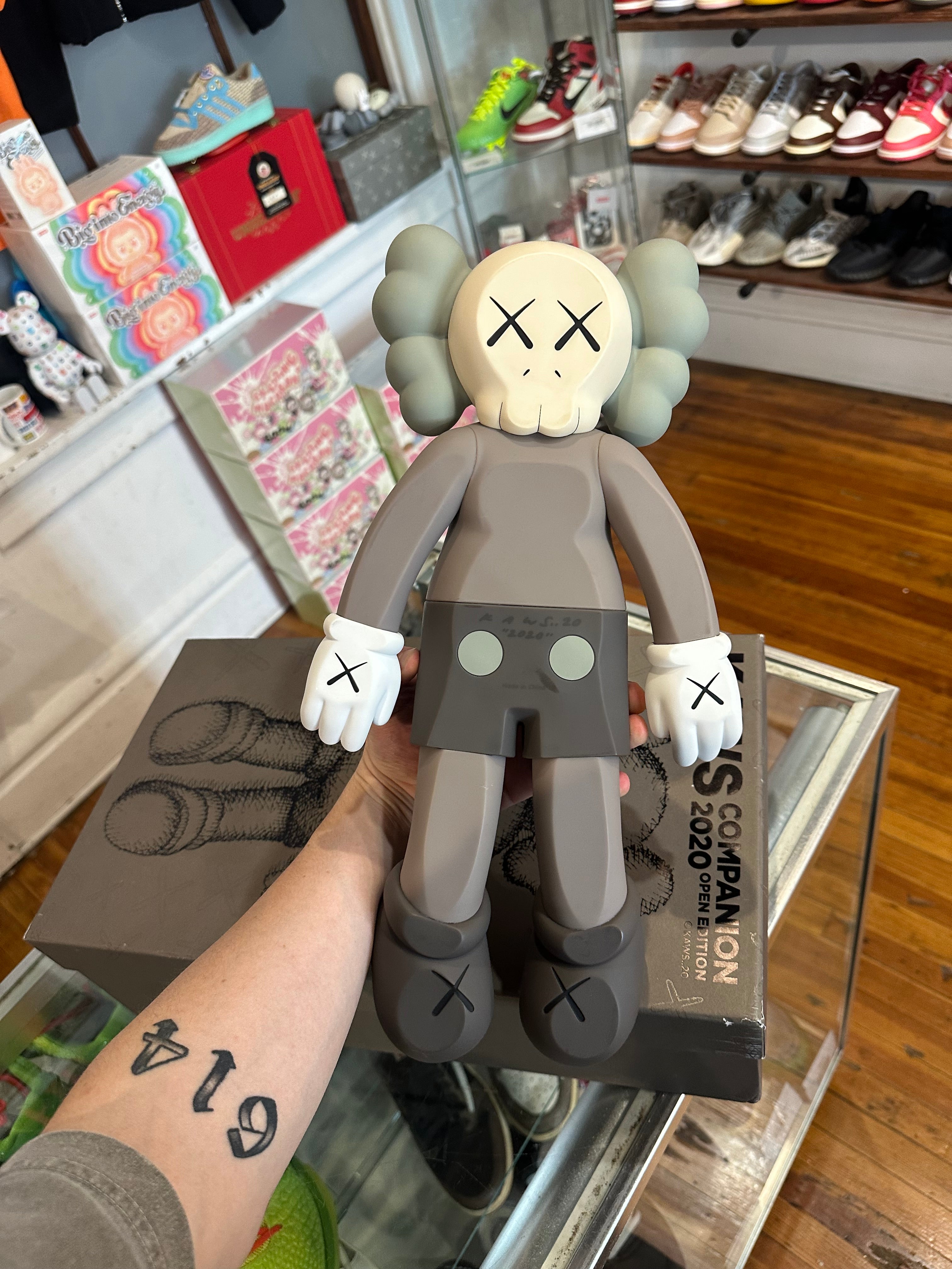 KAWS 2020 Vinyl Figure “Laying Down Brown”
