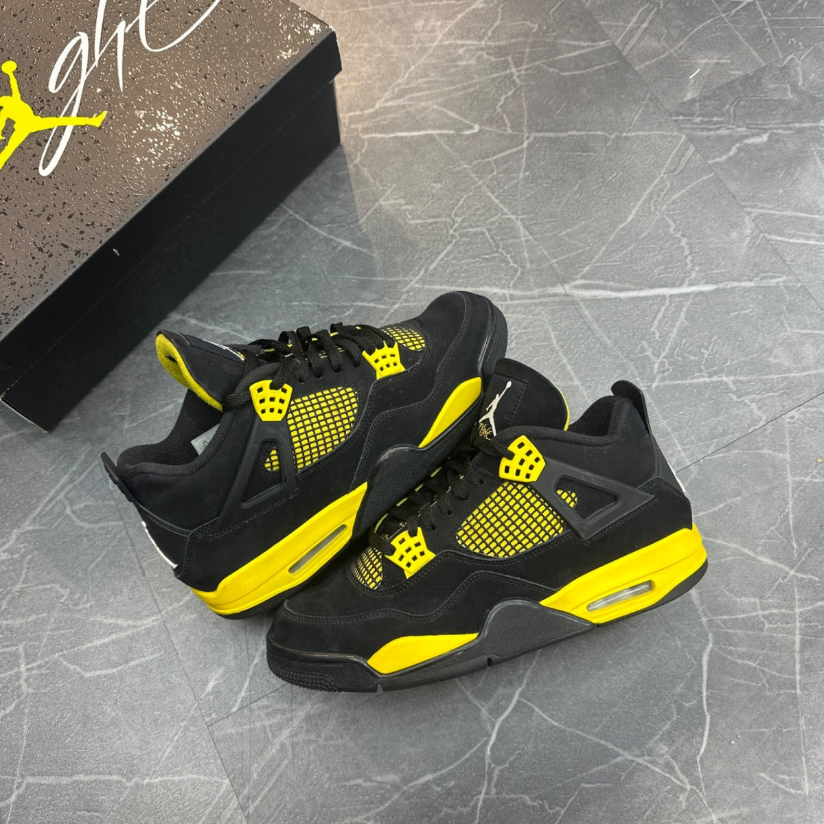 Jordan 4 Retro Thunder (2023) - Image 1