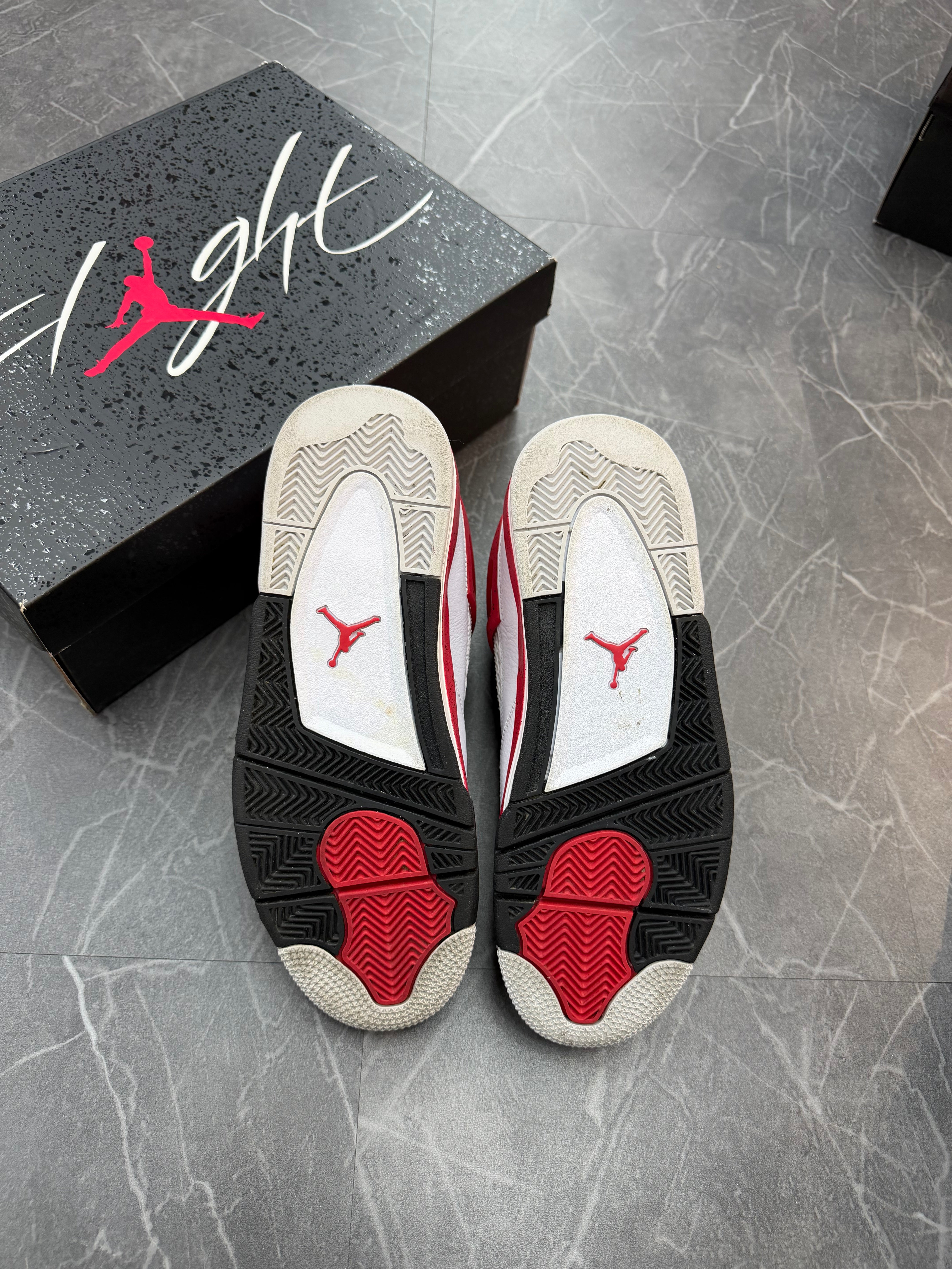 Jordan 4 “Red Cement”
