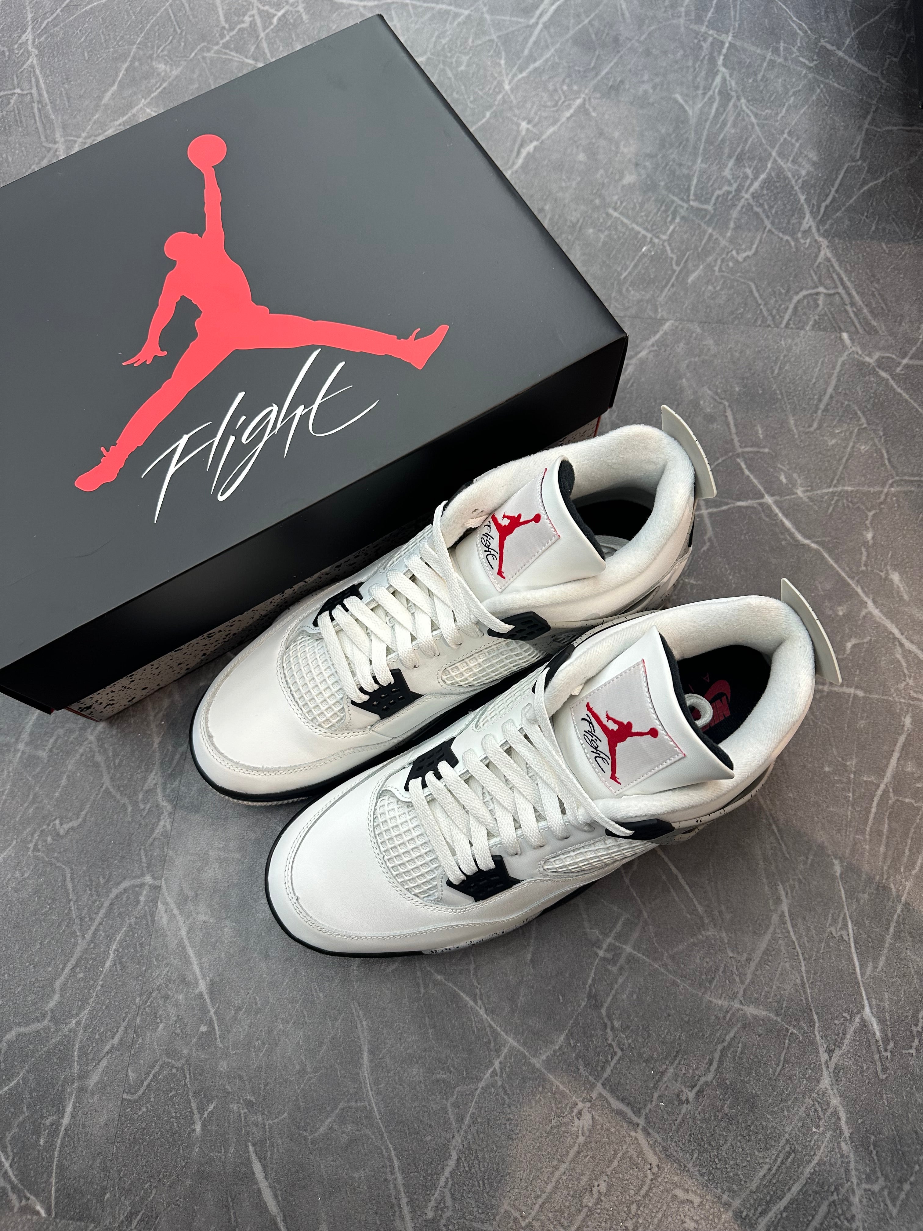 Jordan 4 “White Cement” (2025)