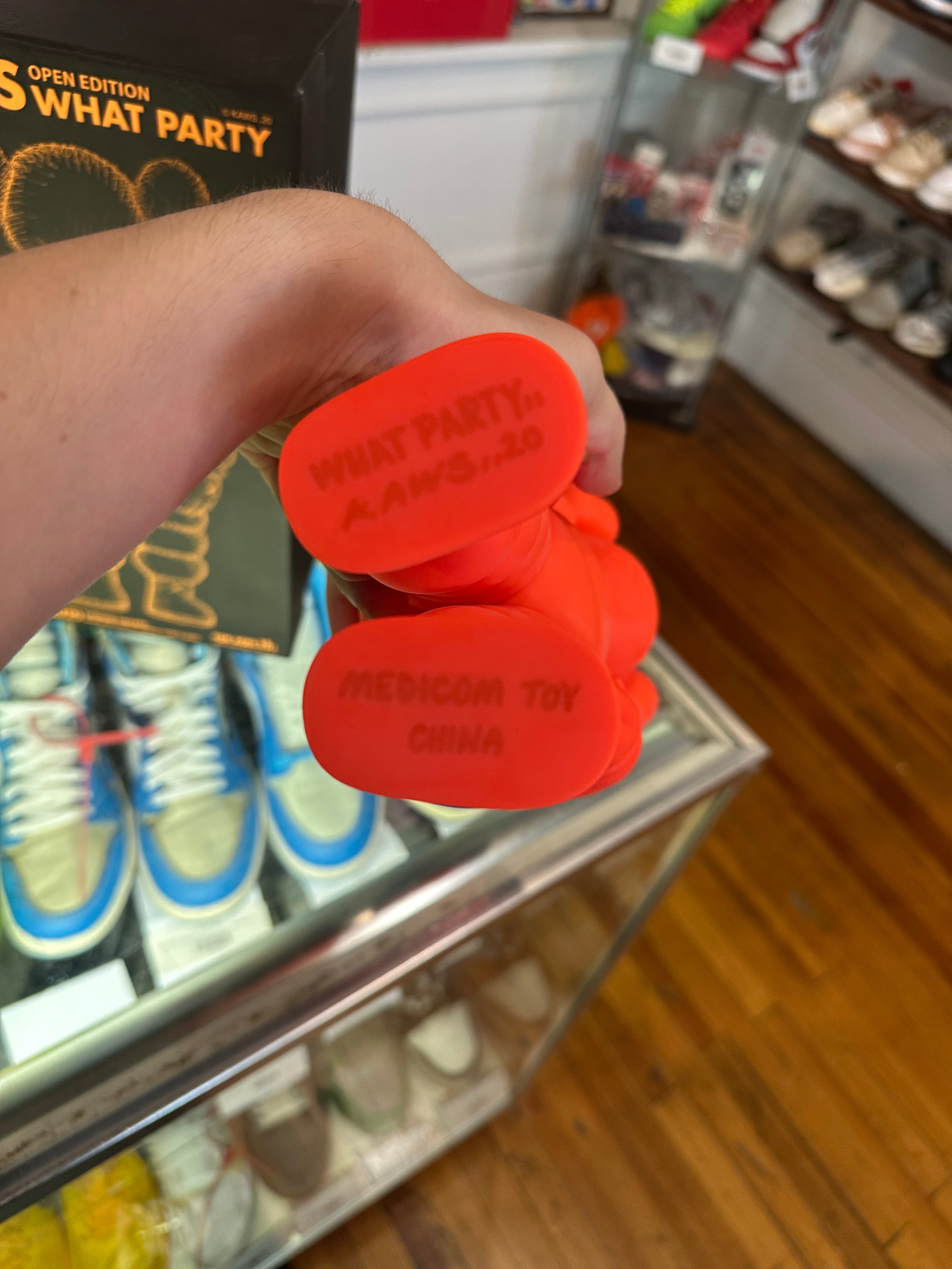 KAWS What Party Vinyl Figure “Orange”