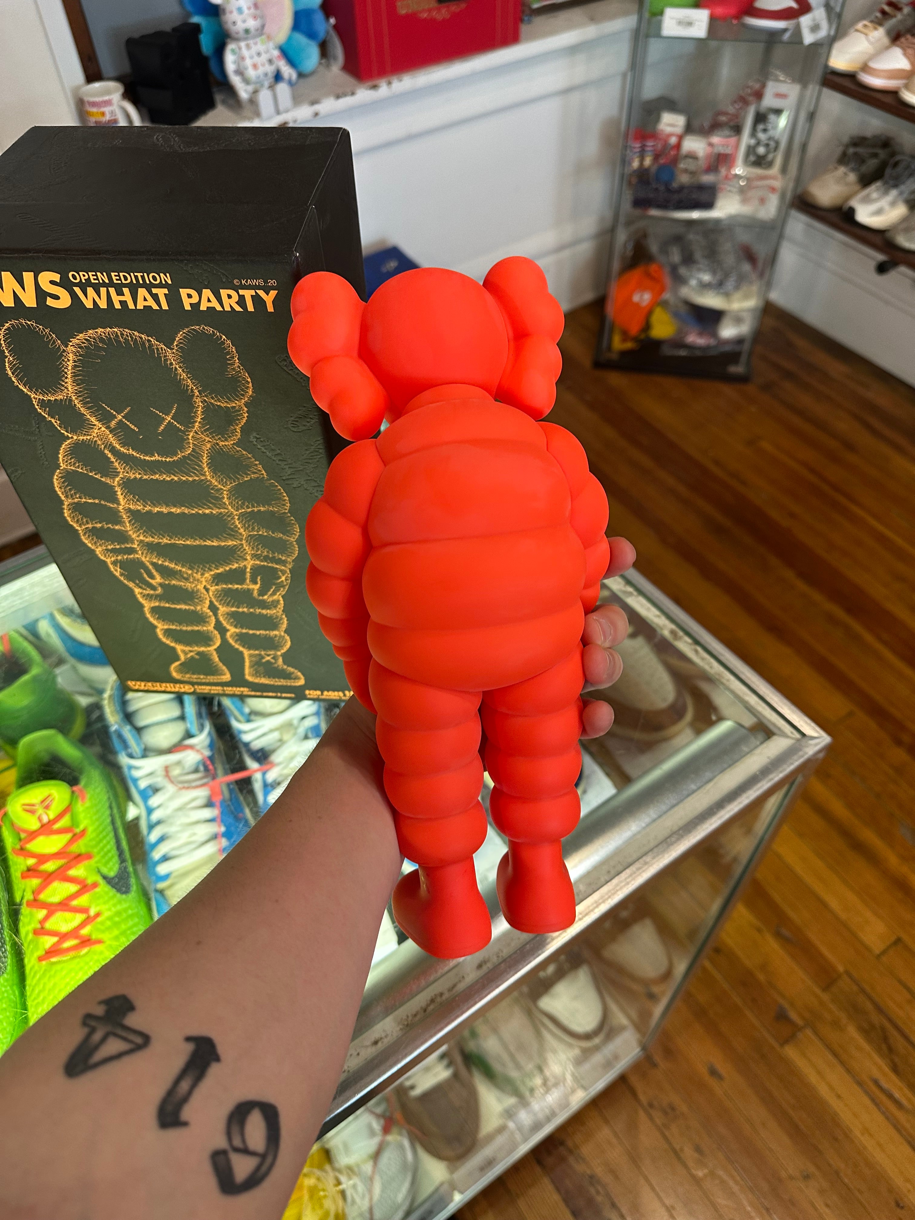 KAWS What Party Vinyl Figure “Orange”