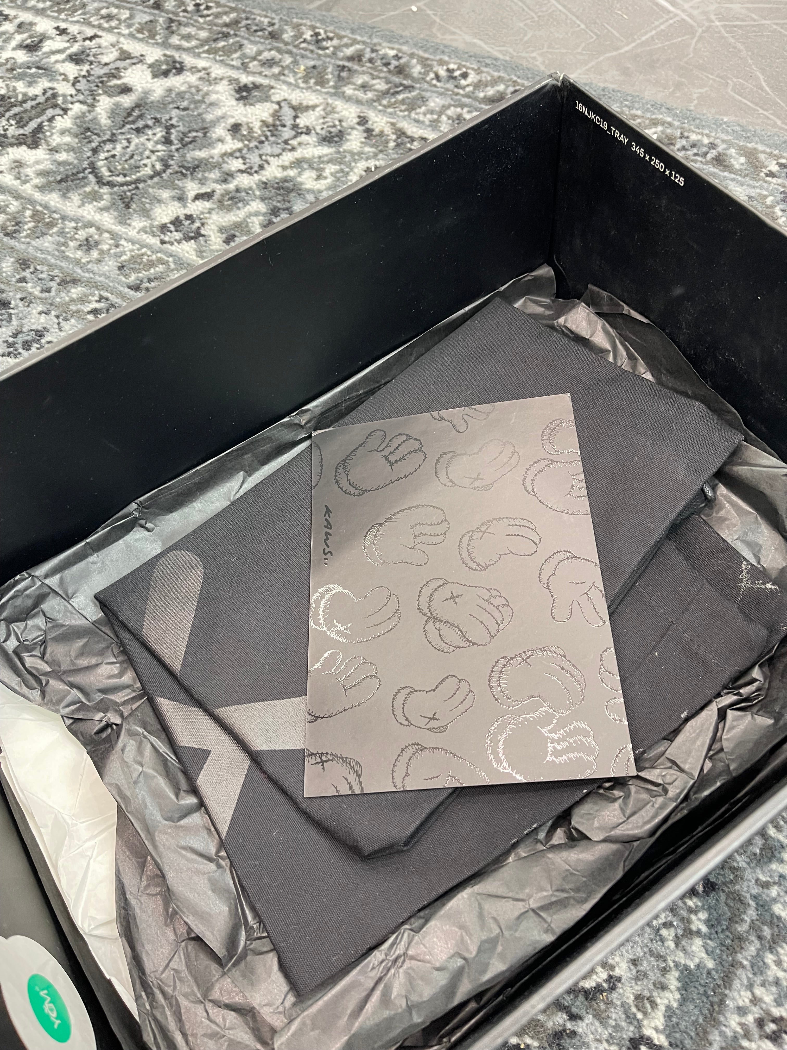 Jordan 4 x Kaws “Black”