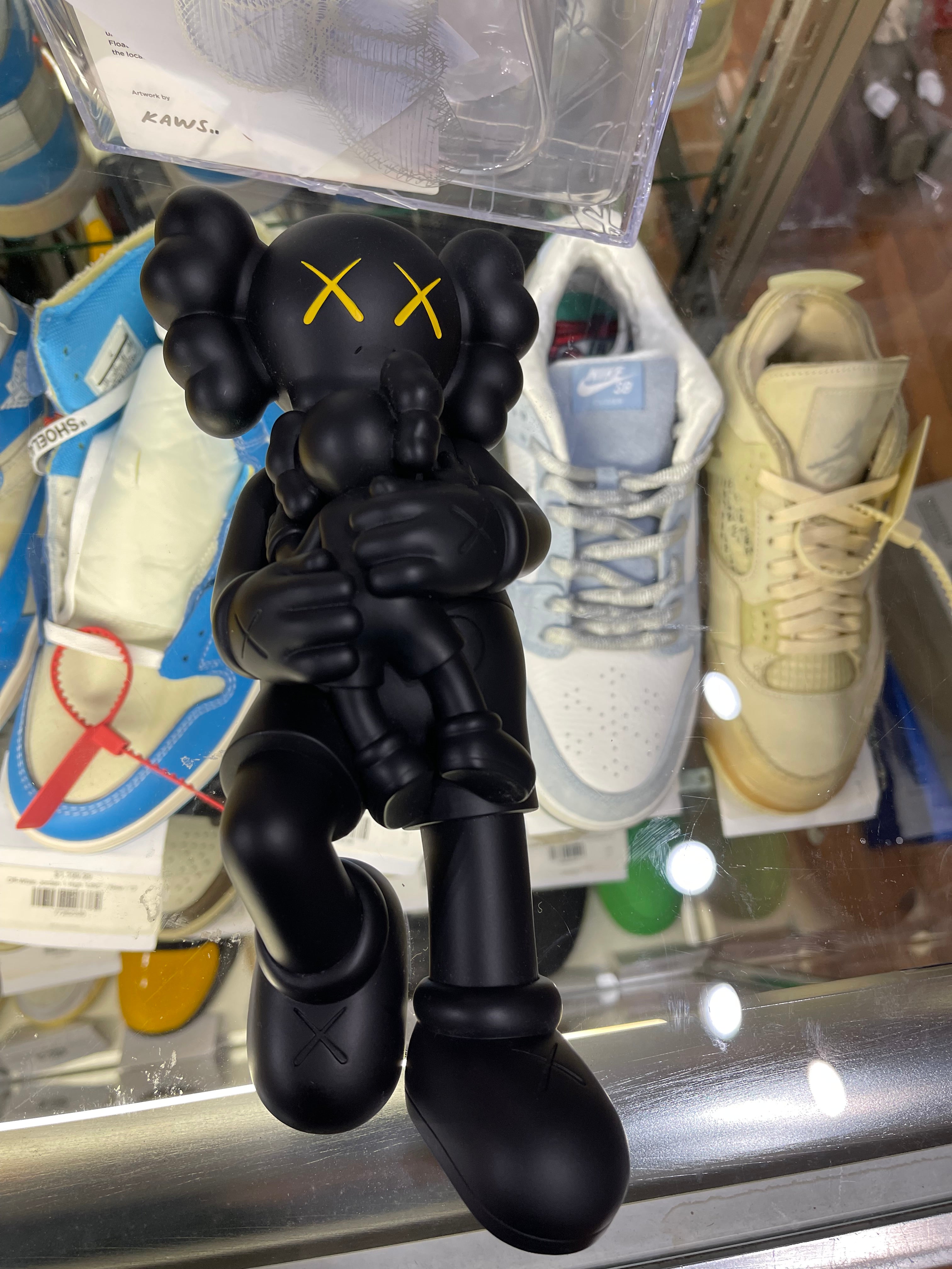 Kaws Holiday Singapore Vinyl Figure “Black”