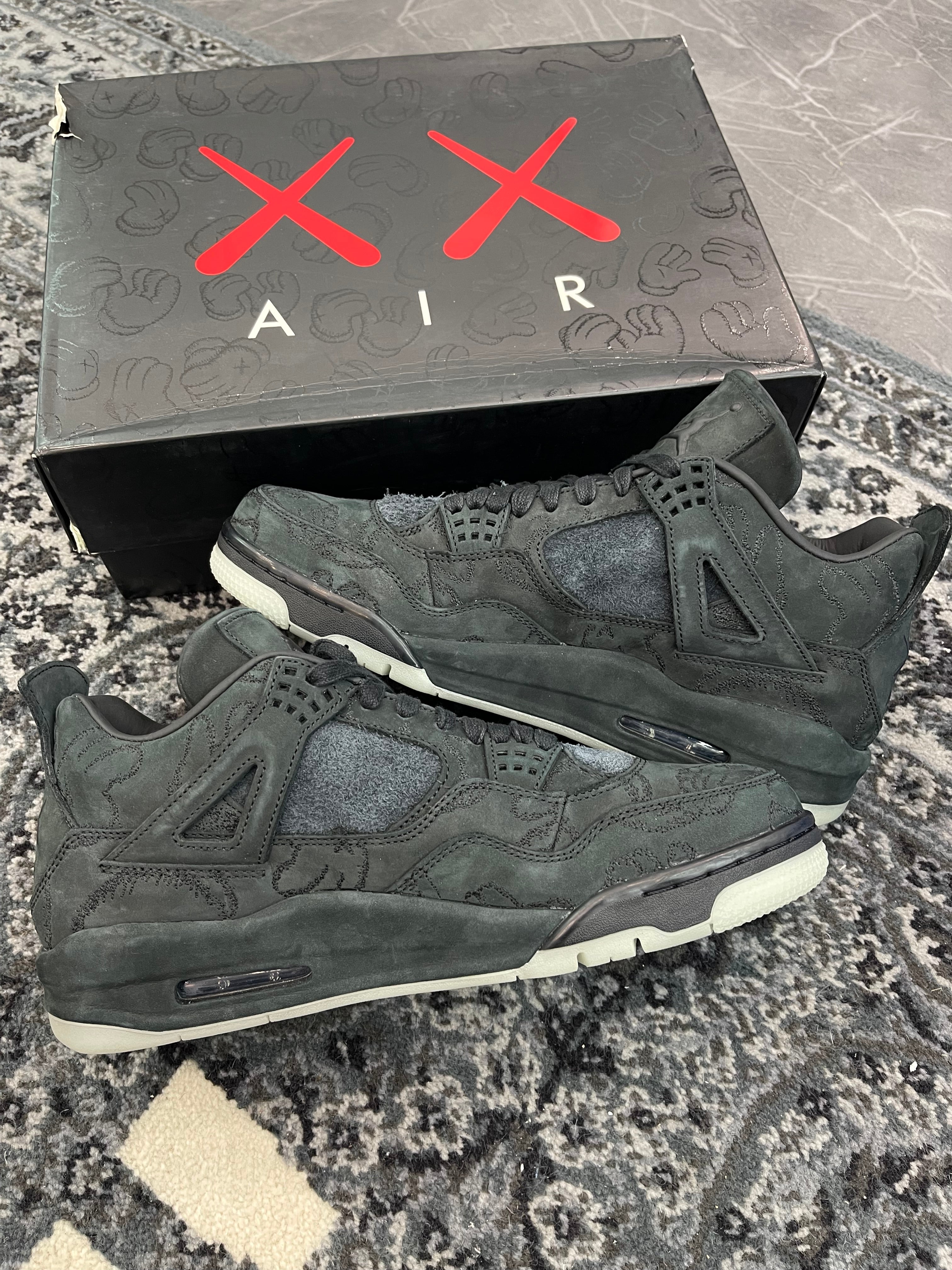 Jordan 4 x Kaws “Black”