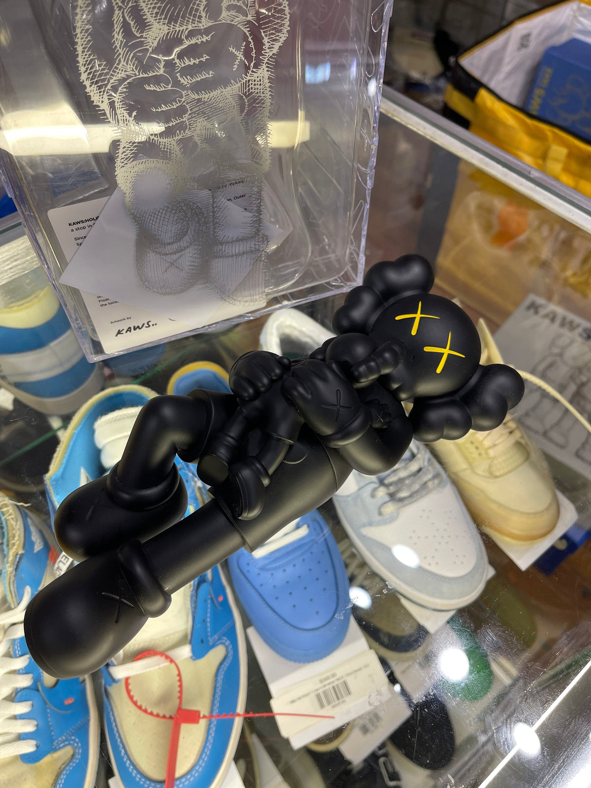 Kaws Holiday Singapore Vinyl Figure “Black” (Size OS) - Image 1
