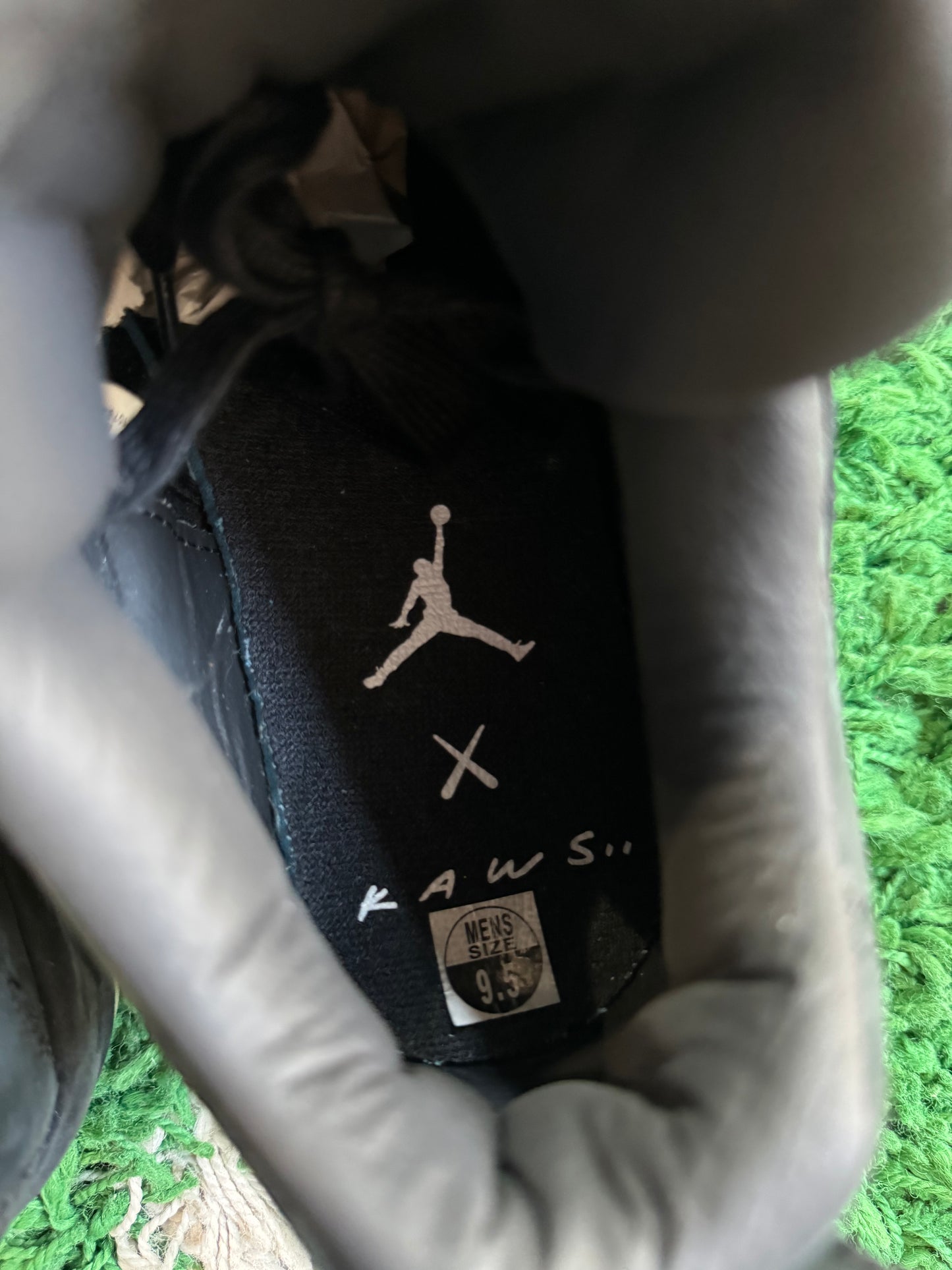 Jordan 4 x Kaws “Black”
