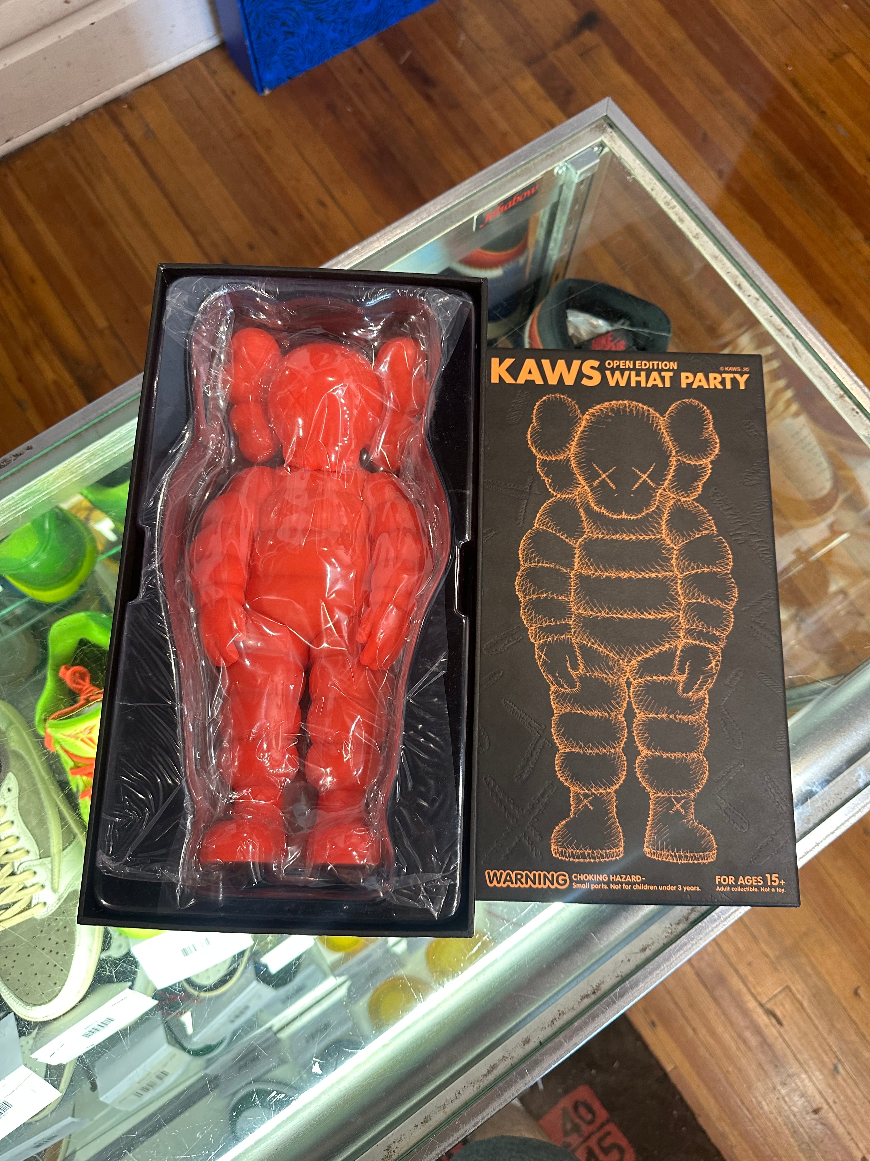 KAWS What Party Vinyl Figure “Orange”