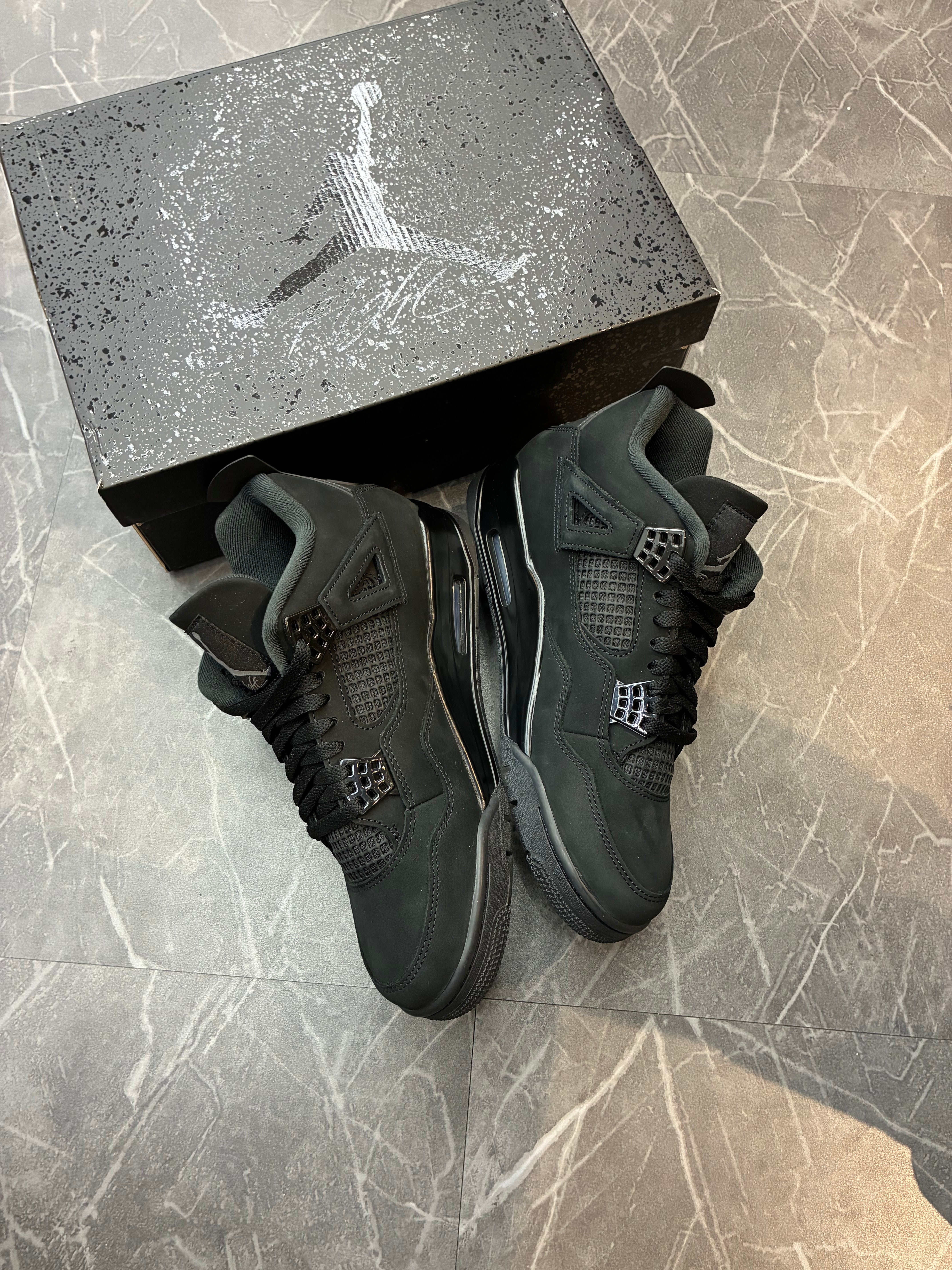 Jordan 4 “Black Cat” (2025)