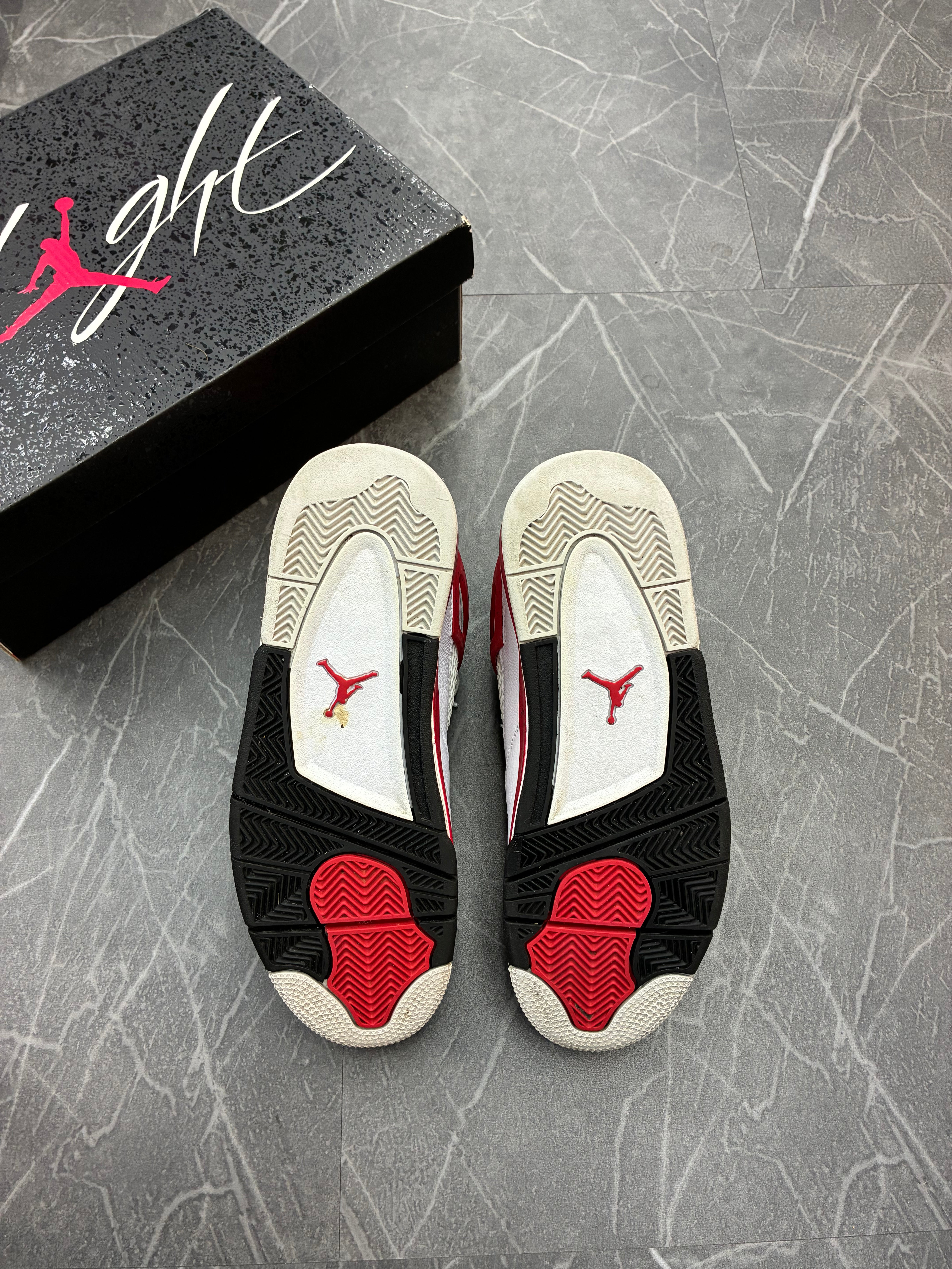 Jordan 4 “Red Cement”