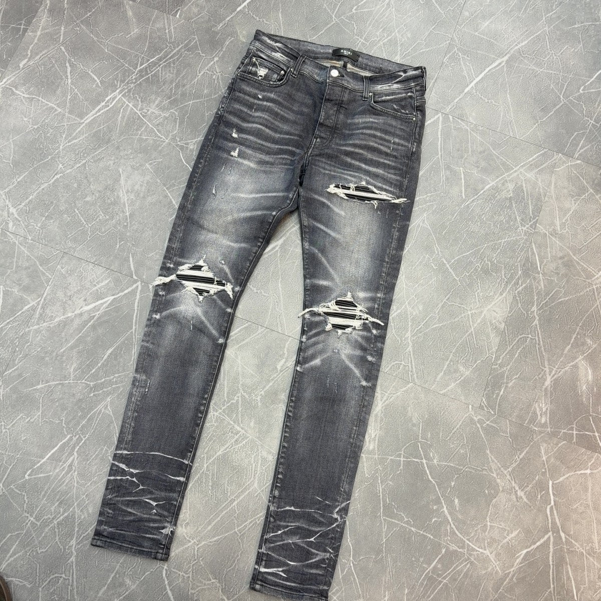 AMIRI Black Ripped Patch Denim